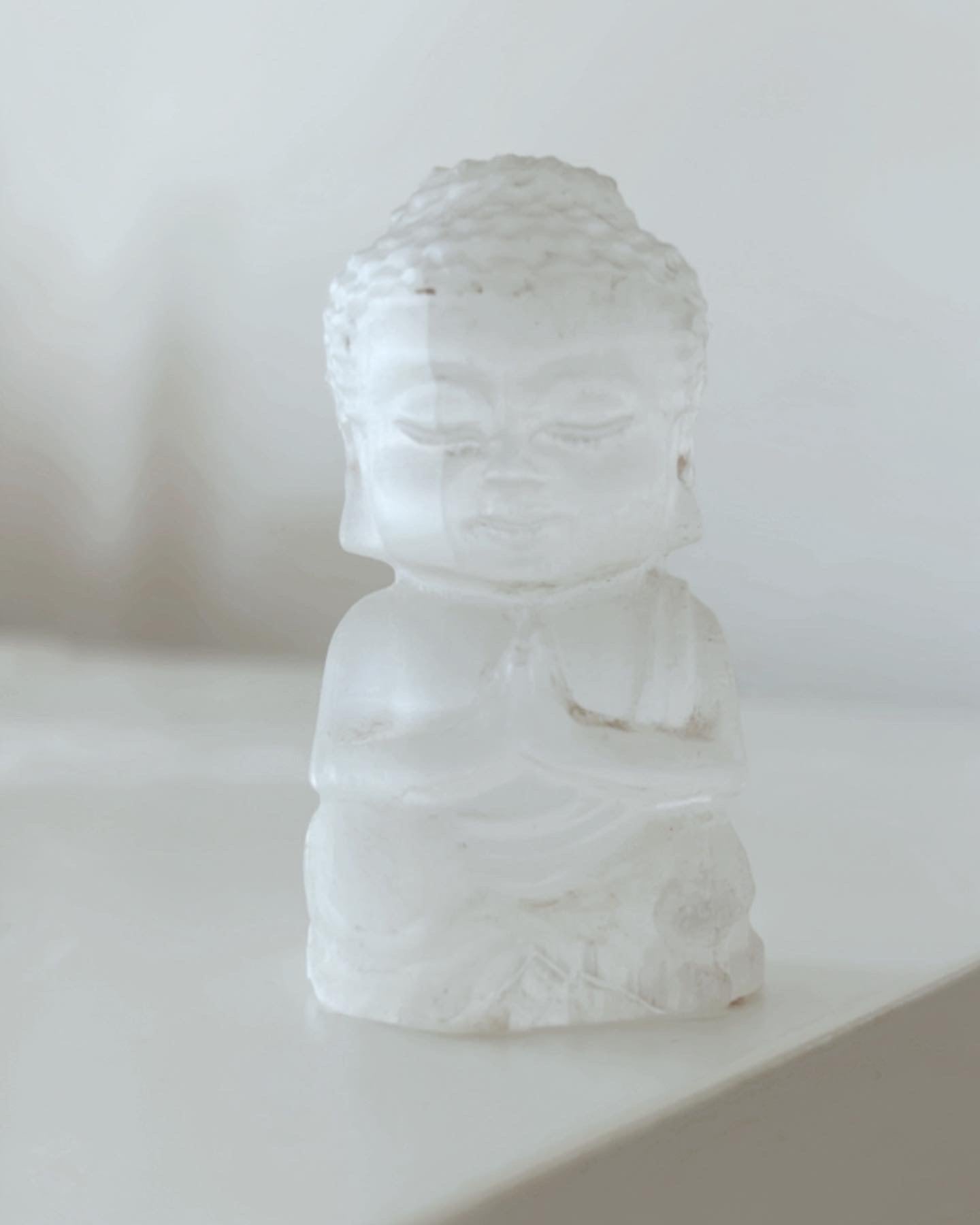 Selenite praying Buddhas