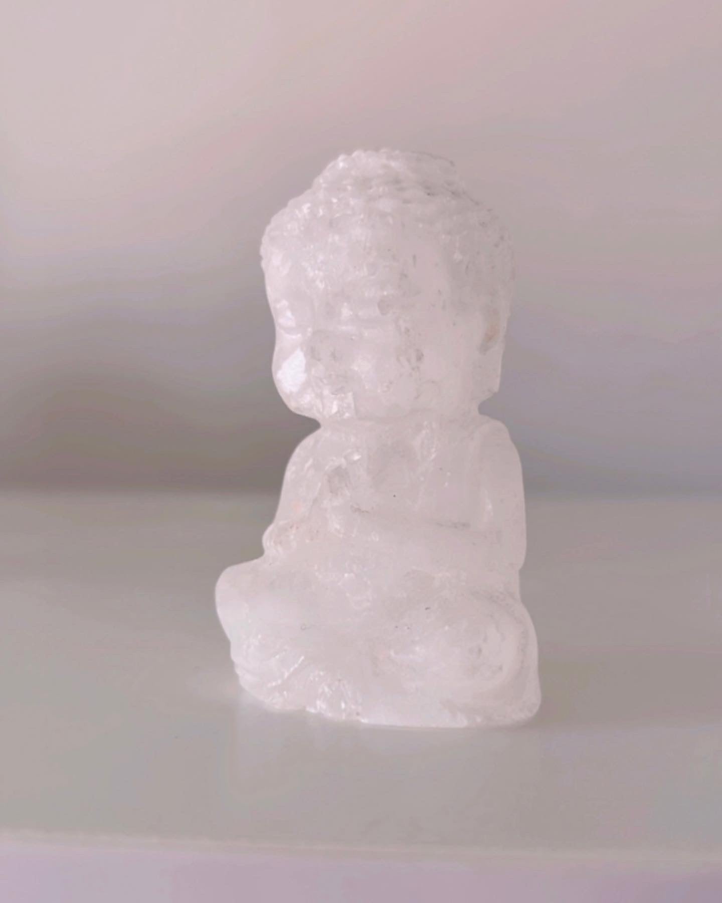 Selenite praying Buddhas