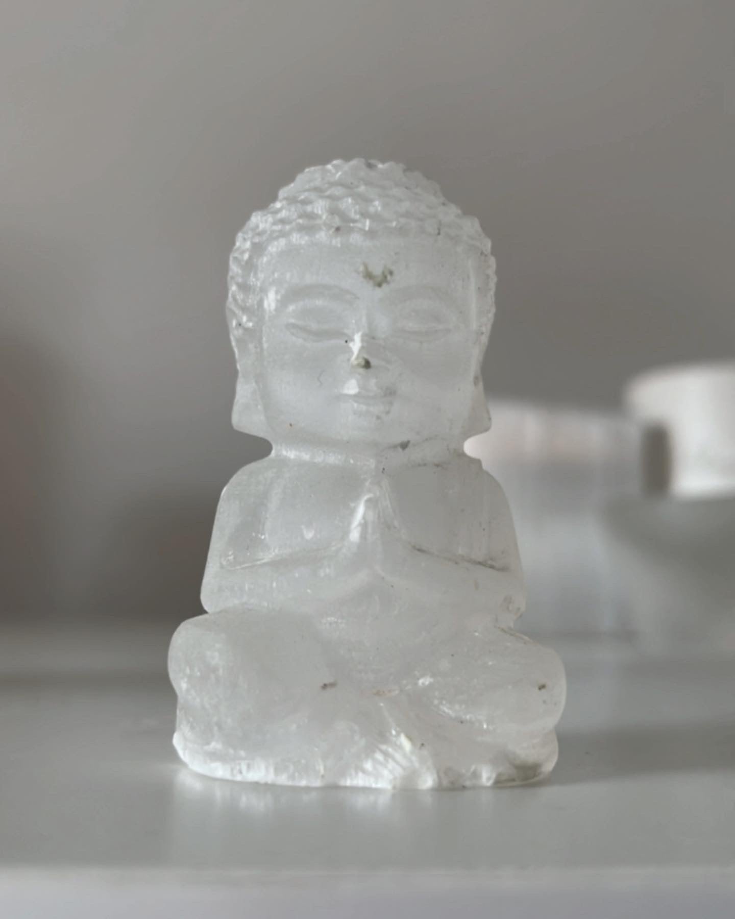 Selenite praying Buddhas