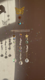 Load and play video in Gallery viewer, Selenite and Clear Quartz sun catcher with butterfly detail
